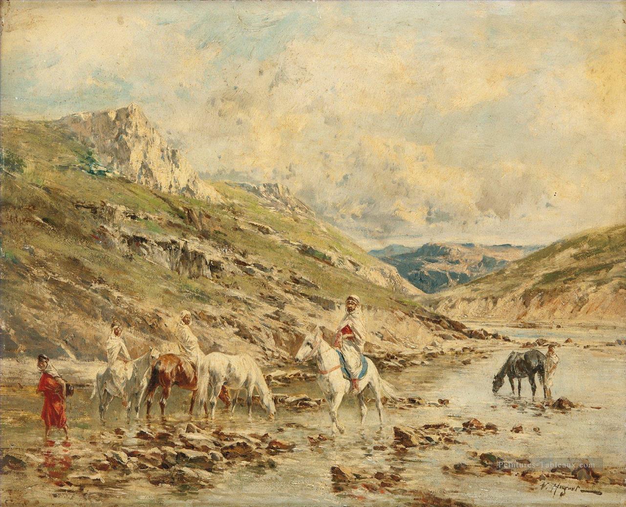 Cavaliers traversant un oued Victor Huguet orientaliste Peintures à l'huile